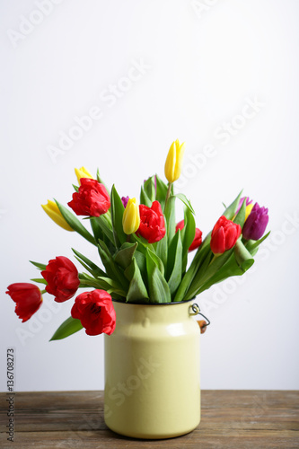 Spring flowers in a vase on a white background