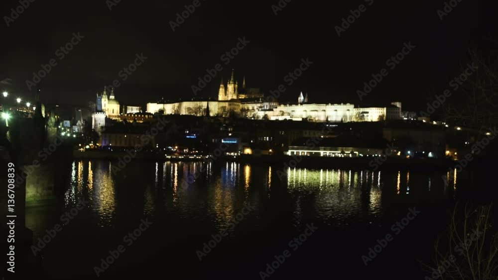 Beautiful Cityscape of Prague at night with Charles Bridge over Vltava river as foreground and Prague Castle in far distance, Czech Republic. Beautiful Cityscape of Prague at night with Charles Bridge over Vltava river as foreground and Prague Castle in far distance, Czech Republic.