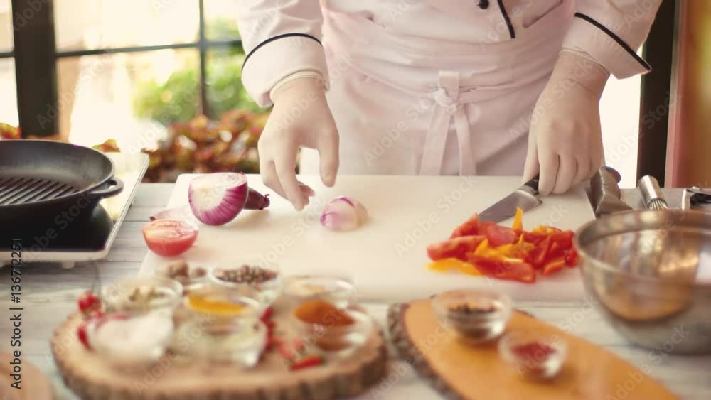 Chef cutting onion. Cooking board with fresh vegetables. Ingredients of spicy soup. Chef cutting onion. Cooking board with fresh vegetables. Ingredients of spicy soup.