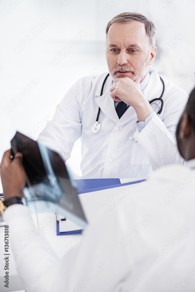 Cool therapeutic sitting near associates in clinic Cool therapeutic sitting near associates in clinic