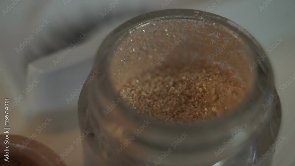 Jar with golden shades makeup Jar with golden shades makeup