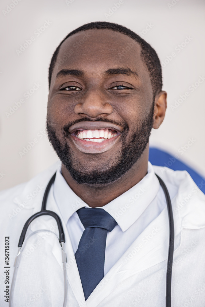 Face of happy doctor situating in hospital Face of happy doctor situating in hospital