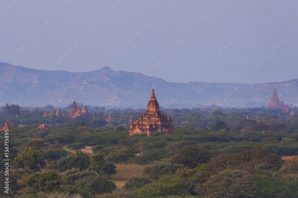 Ancient Pagoda in Bagan with the mountains in the background 