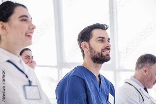 Wallpaper Mural Smiling doctor looking discourse in hospital room Torontodigital.ca