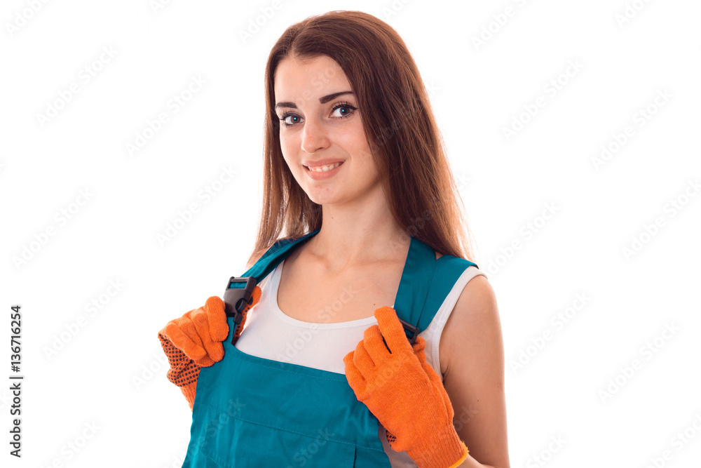portrait of young cheerful brunette builder girl makes renovation isolated on white background portrait of young cheerful brunette builder girl makes renovation isolated on white background