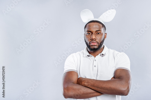 Confident guy posing in rabbit ears