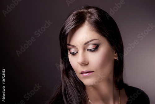lose-up portrait of girl on isolated background with the demonstration of professional makeup