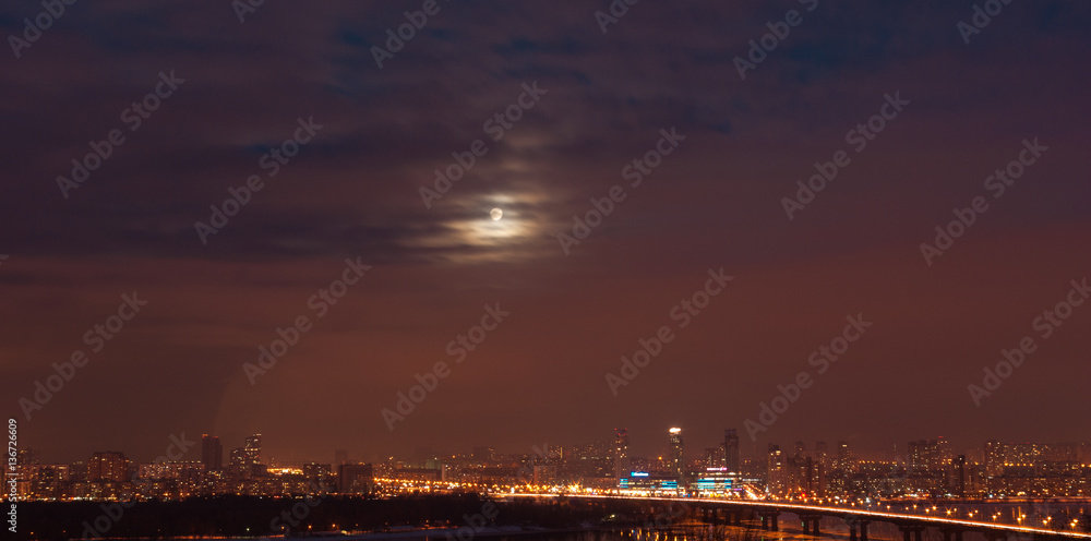 Kiev. Moon over the city.