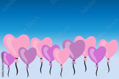 pink and violet heart shaped balloons on sky-blue background