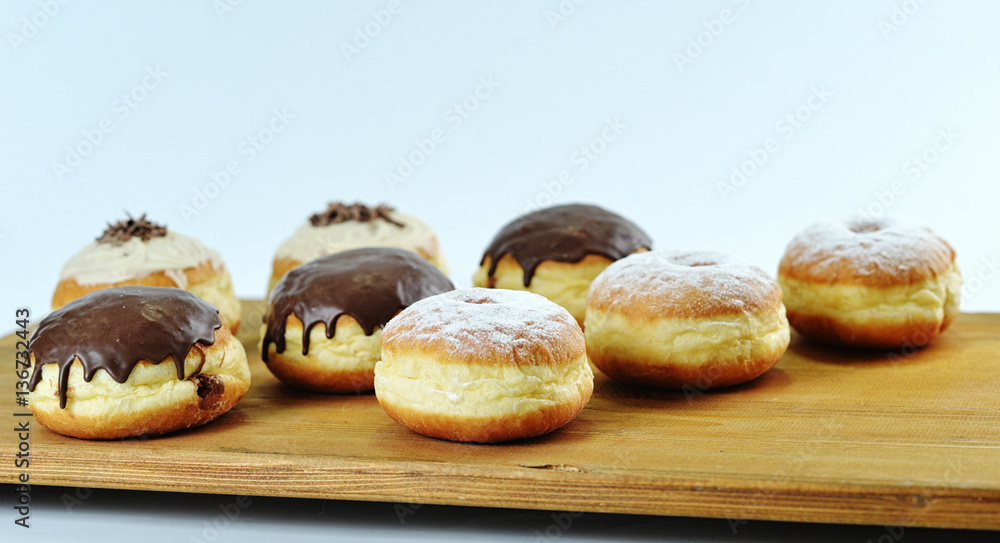 Close up. Beautifully arranged delicious doughnuts with icing, s Close up. Beautifully arranged delicious doughnuts with icing, s