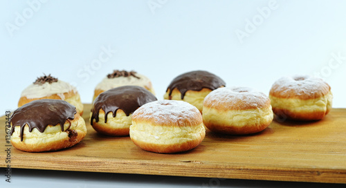 Close up. Beautifully arranged delicious doughnuts with icing, s © OctaCorp