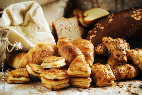 Bakery product assortment with bread loaves, buns, rolls and Dan