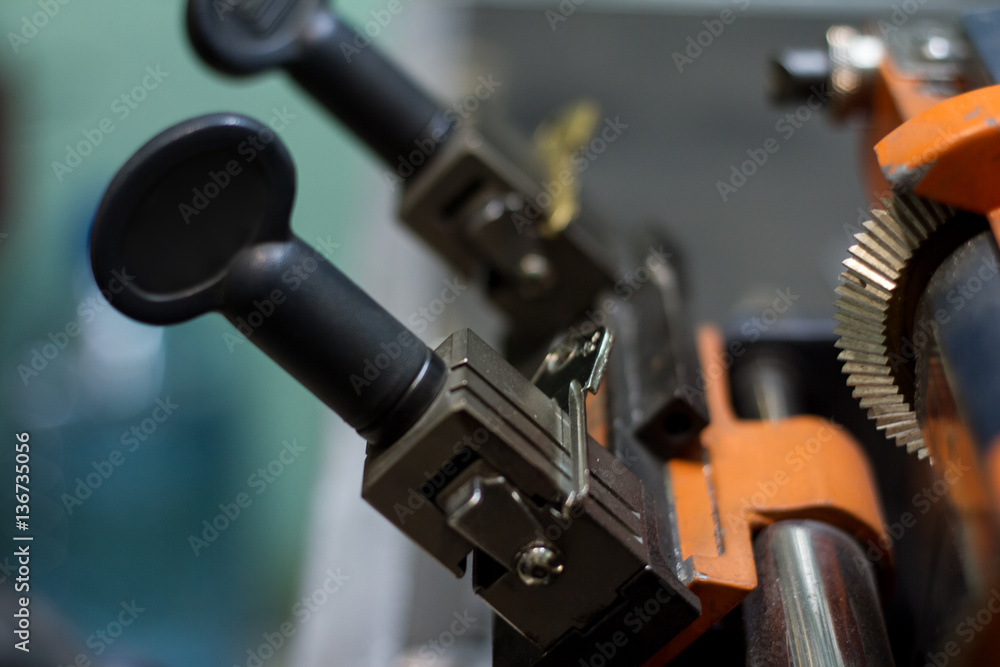 Fototapeta premium Machine production of duplicate metal key.
