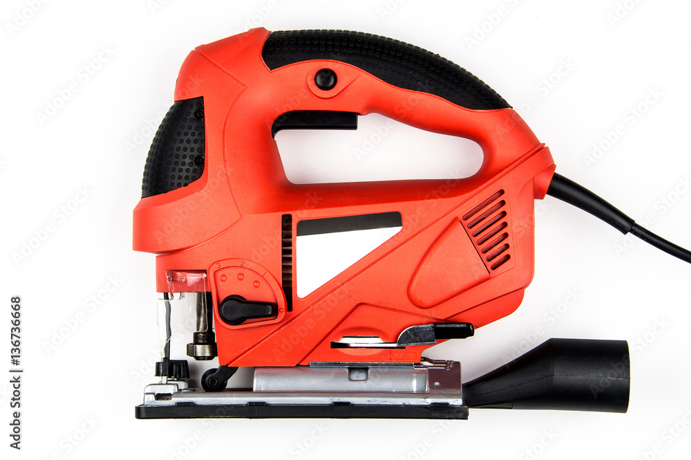 Professional red fretsaw isolated on a white background Professional red fretsaw isolated on a white background
