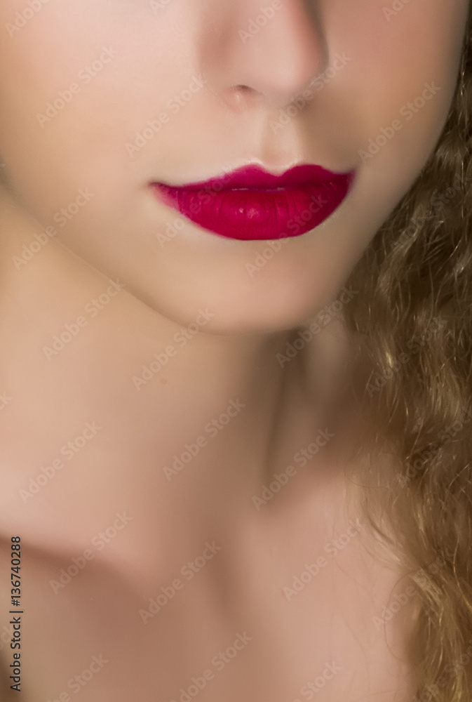 Close up of young woman beautiful lips with red lipstick. Close up of young woman beautiful lips with red lipstick.