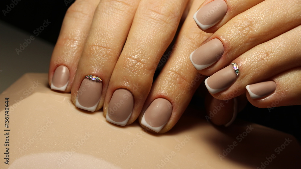 Matt French manicure nails inlaid Swarovski crystals Stock Photo | Adobe  Stock