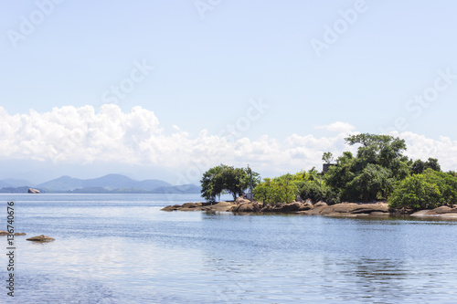 Brazil, State of Rio de Janeiro, Paqueta Island, View of small island with mountains on the background