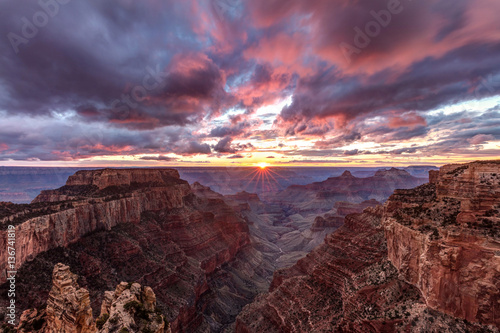 A dreamy sunset with a dramatic sky and clouds at cape royal inside the north rim of the Grand Canyon National Park, Arizona