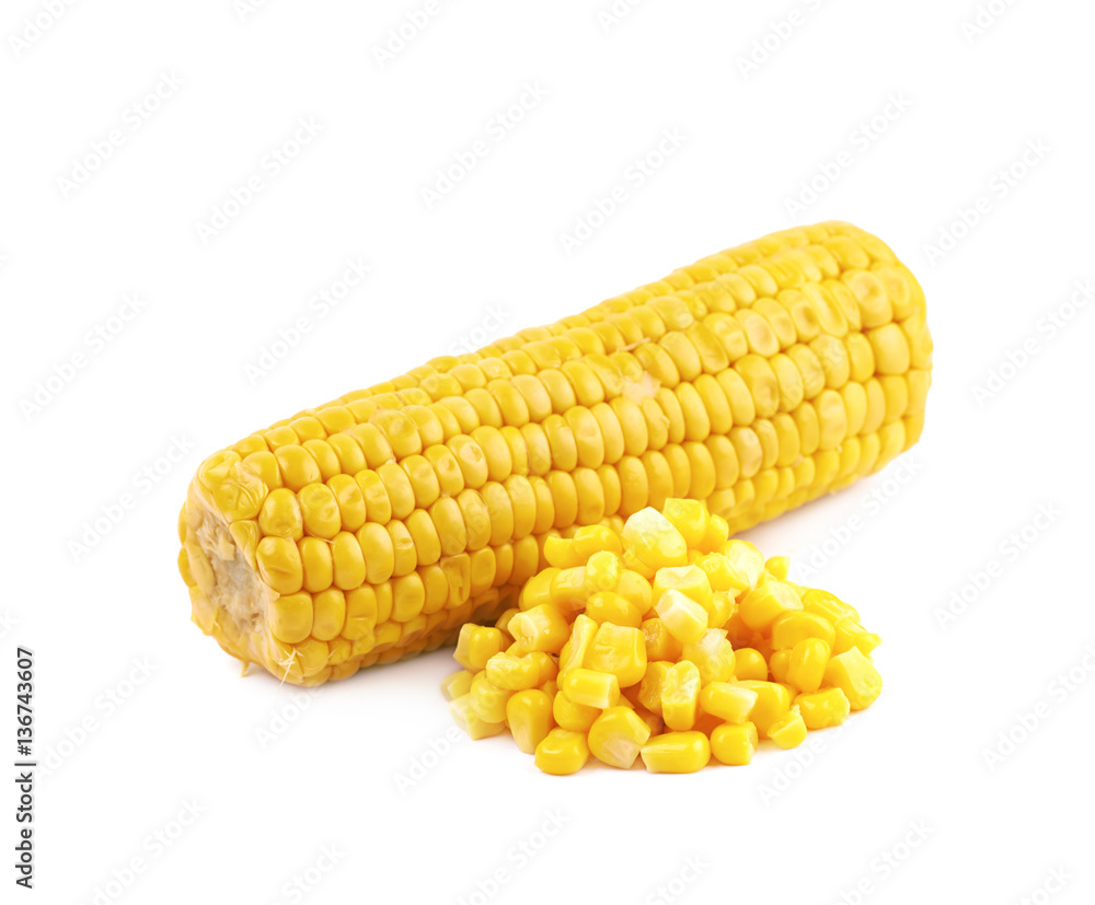 Corncob next to a pile of kernels