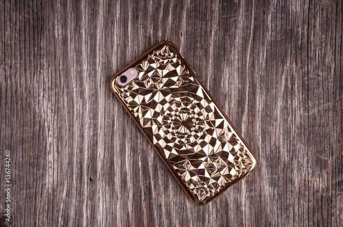 Plastic phone case on rustic wood