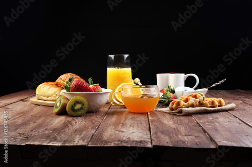 breakfast in bed with fruits and pastries on a tray -waffles, cr