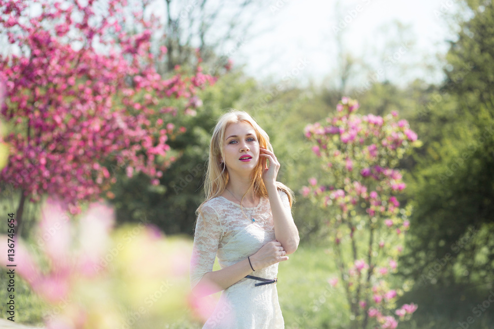 Beautiful girl in blooming spring garden Beautiful girl in blooming spring garden