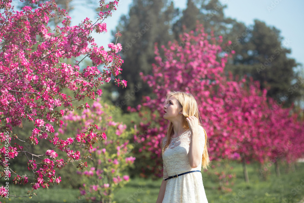 Beautiful girl in blooming spring garden Beautiful girl in blooming spring garden