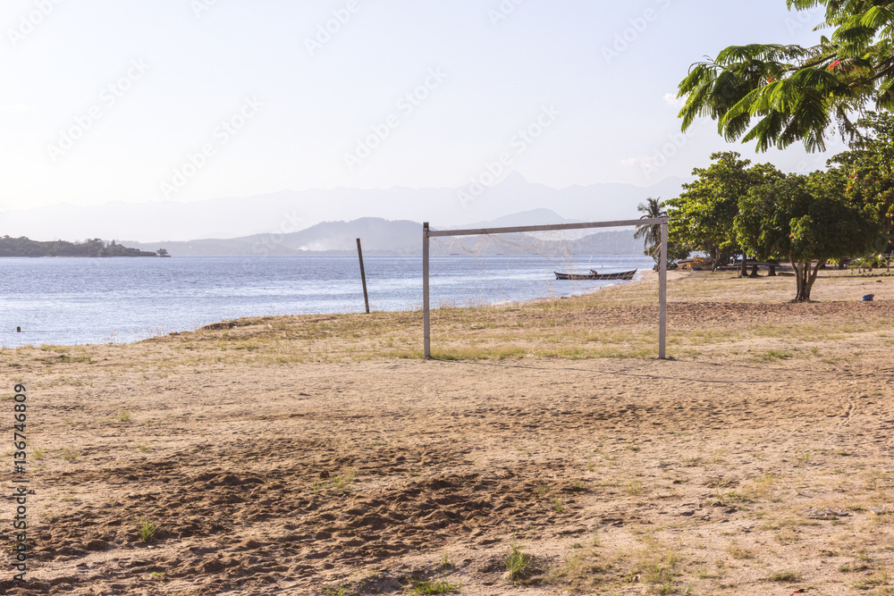 Brazil, State of Rio de Janeiro, Paqueta Island, View of boat by the beach during afternoon with mountains on the background Brazil, State of Rio de Janeiro, Paqueta Island, View of boat by the beach during afternoon with mountains on the background