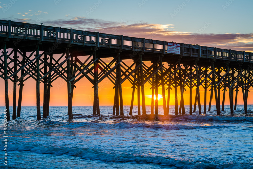 The pier at sunrise, in Folly Beach, South Carolina.