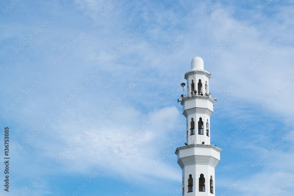 Beautiful architecture, minaret and dome of Tengku Tengah Zaharah Mosque with blue sky background,iconic floating mosque located at Terengganu Malaysia.