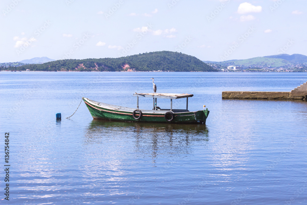 Brazil, State of Rio de Janeiro, Paqueta Island, View of bird on top of a fishing boat