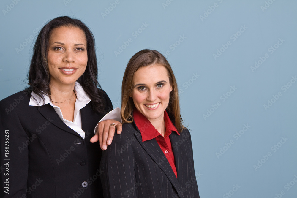 Happy confident businesswomen smiling at work Happy confident businesswomen smiling at work