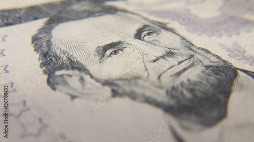 Closeup of Abraham Lincoln on Five Dollar Bill photo