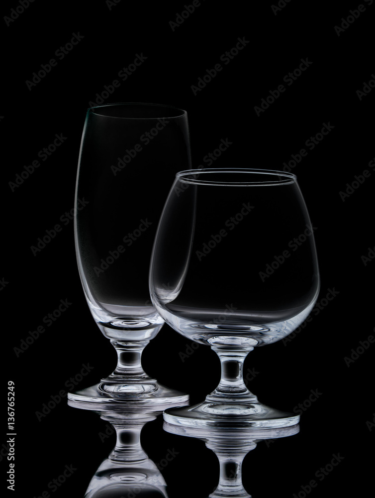 Clear crystal wine glasses,closeup shot on black isolated. Clear crystal wine glasses,closeup shot on black isolated.