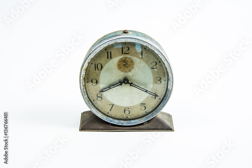 old vintage alarm clock on white background