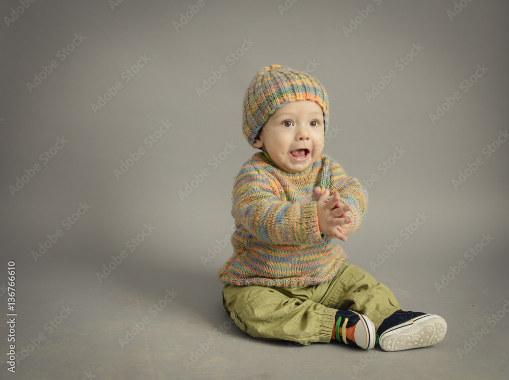 Small boy in winter dress isolated inside studio Small boy in winter dress isolated inside studio