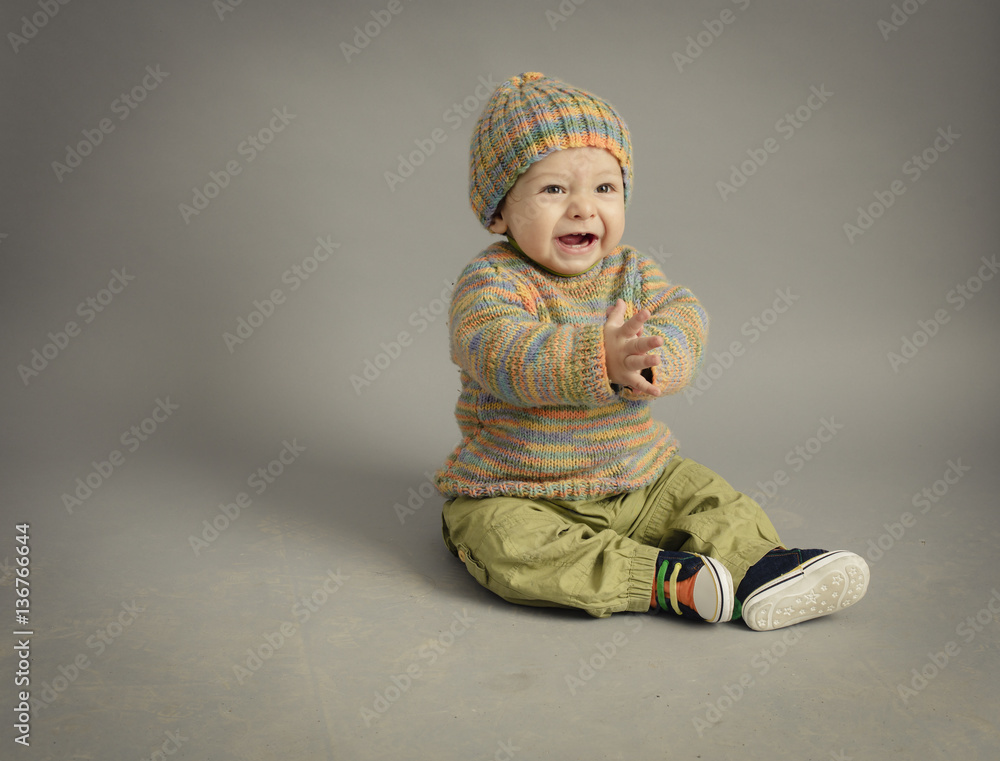 Small boy in winter dress isolated inside studio Small boy in winter dress isolated inside studio