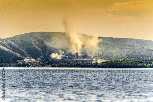 The chemical plant polluting the environment.