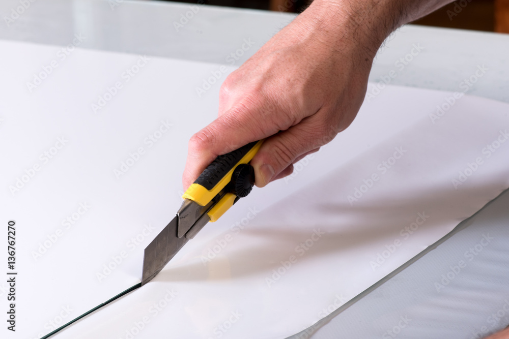 Cutting paper with utility knife