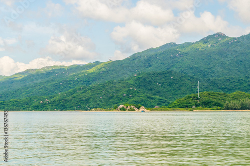 Sea landscape with island shore and clouds - the South China sea - Vietnam, Nha Trang bay	