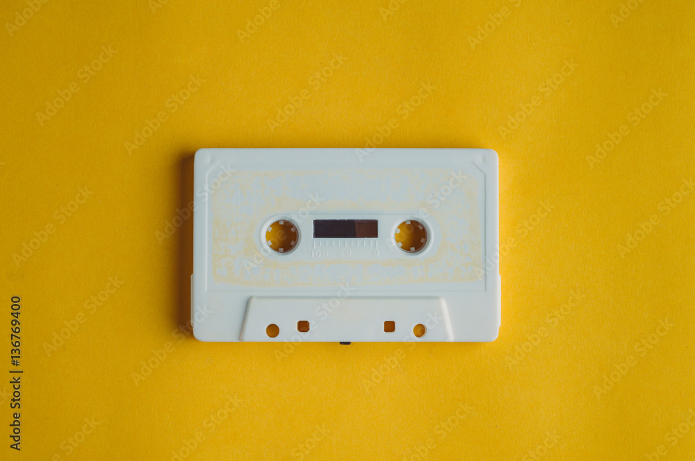 Old audio tape on a yellow background. Music concept Old audio tape on a yellow background. Music concept