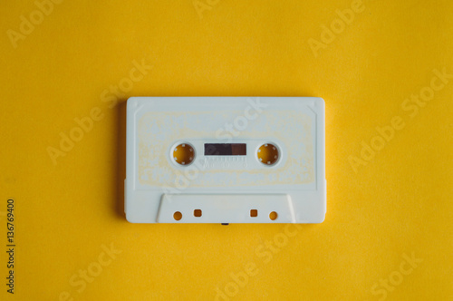 Old audio tape on a yellow background. Music concept