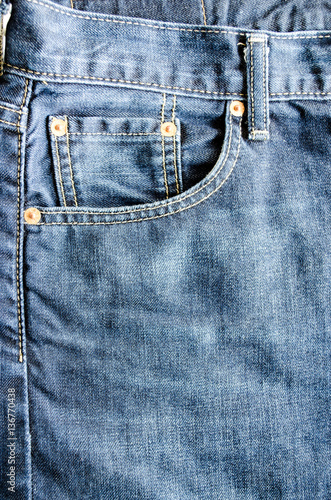 Close up Money Pocket in Front Pocket of Blue Jeans as Background Composition.