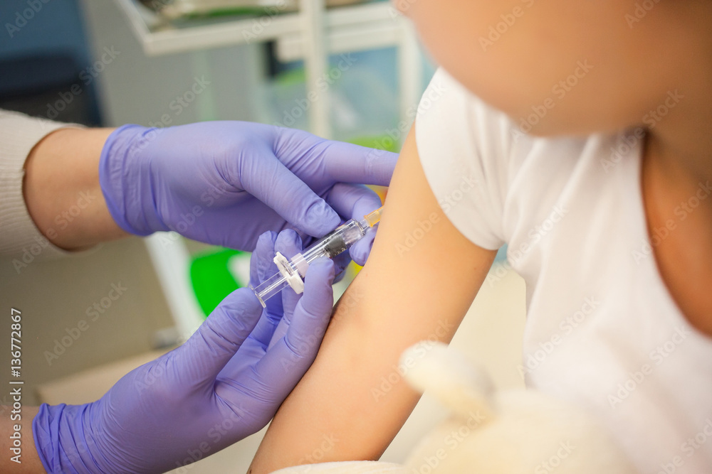 The pediatrician or nurse to vaccinate boy or girl, child vaccination The pediatrician or nurse to vaccinate boy or girl, child vaccination