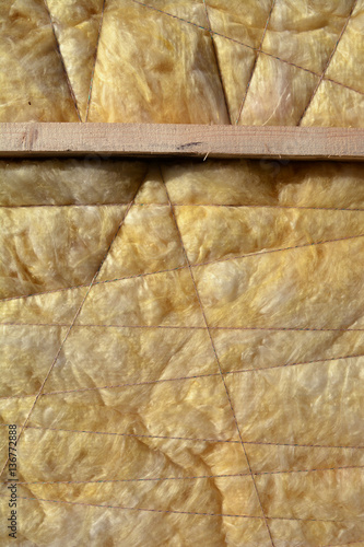 insulation material rock-wool on wall background