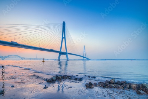 Sunset at The River Spanning Bridge Over The Yangtze River in Nanjing City