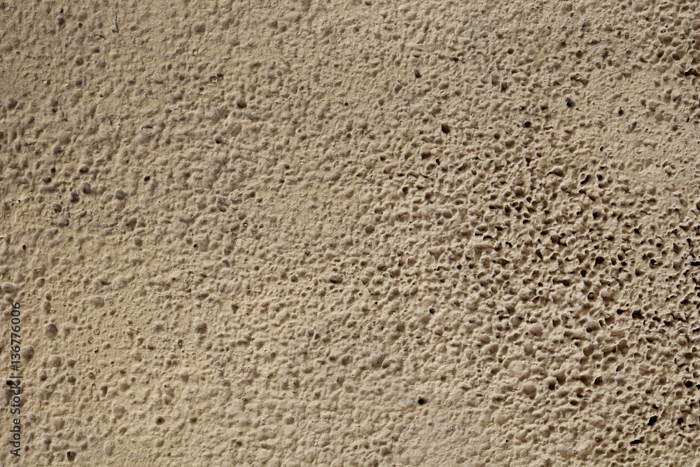 Concrete stone wall of grunge sand textured background. rough finish. template for design Concrete stone wall of grunge sand textured background. rough finish. template for design
