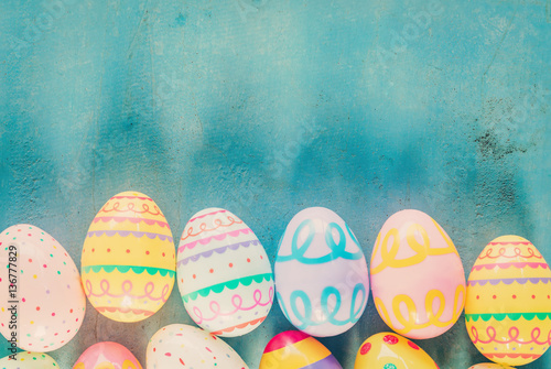 Colorful easter egg on blue pastel color wood background