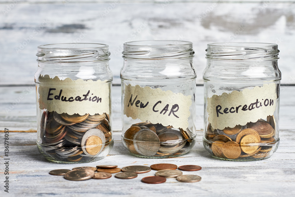 Three transparent jars with coins. Value and sell your coins. Three transparent jars with coins. Value and sell your coins.
