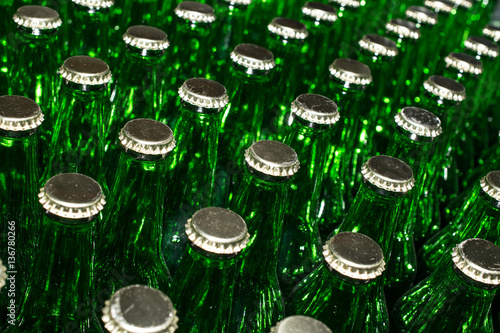 green beer bottles with crown caps